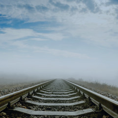 railroad in fog to horizon. soft focus