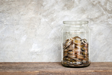 Glass jar with coins.