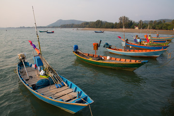Naklejka na ściany i meble Fisherman's boats parked in the sea