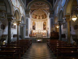 Fototapeta na wymiar Old empty Catholic church with classic paintings