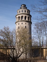 Fototapeta premium Old water storage tower with arched windows