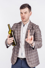 man with a bottle of wine making stop sign