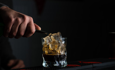 bartender mixer pouring cocktail into glasses Vodka