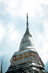 white stupa part of buddhist temple