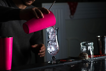 bartender mixer pouring cocktail into glasses Vodka
