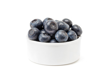 blueberry fruit in white cup isolated on white background