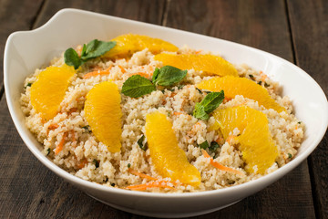 Salad of crumbly couscous with carrots, orange and mint