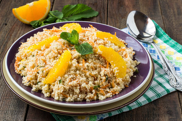 Salad of crumbly couscous with carrots, orange and mint