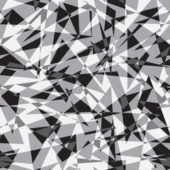 Irregular grey monochrome triangles. Seamless vector pattern.