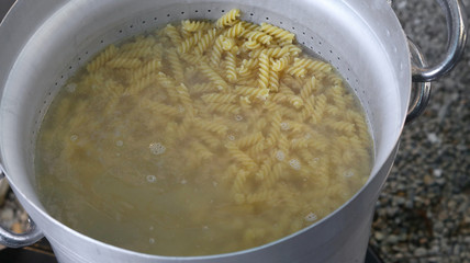 pasta called FUSILLI in Italy cooked in the very hot water in la