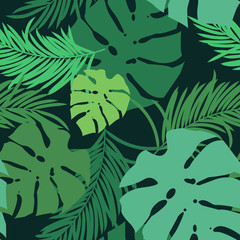 Fototapeta na wymiar Flat designed seamless pattern with tropical leaves