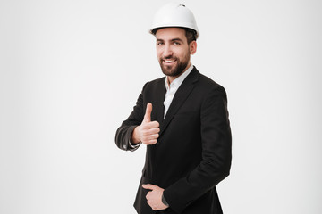 Smiling architect with thumbs up.