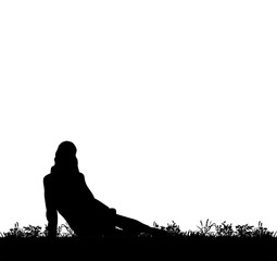  silhouette of a girl sitting on the grass