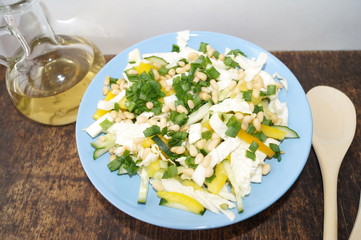 Organic, vegetarian salad from fresh vegetables with pine nuts