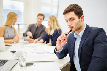 Young businessman looking pensive