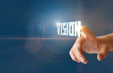 Businessman clicks the word vision .