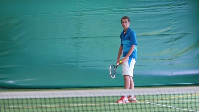 Tennis player unsuccessfully hit the ball on court