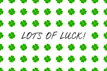 Saint Patrick's Day greeting card with green mosaic clover leaves and text on white background. Inscription - LOTS OF LUCK! vector illustration.