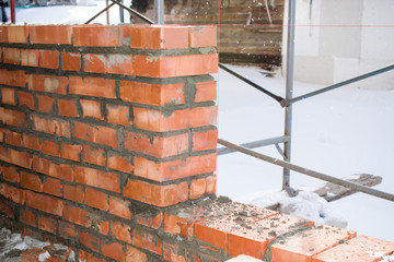 Reupload the wall of bricks with cement in construction
