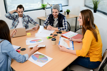 Fototapeta premium group of young cool hipster business people in casual wear working together in meeting room of a startup company