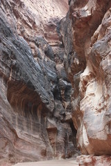 "Siq" the narrow long ravine and main entrance to ancient Nabatean city of Petra in Jordan, Middle East