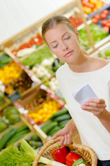 Lady shopping, checking list