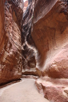 "Siq" the narrow long ravine and main entrance to ancient Nabatean city of Petra in Jordan, Middle East