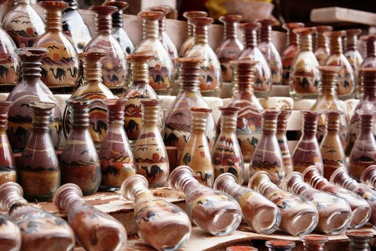 Traditional souvenirs in Petra in Jordan, Bottles with sand shows desert and camels 