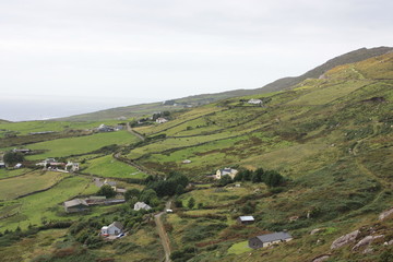 Fototapeta premium Irish hills and cottages rural landscape