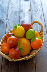 Fruit basket on wooden background