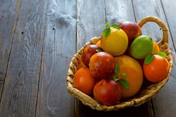 Fruit basket on wooden background