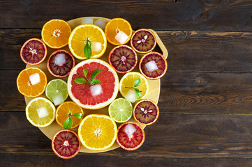 Citrus fruits on wooden background