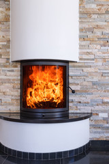 An interior shot of a modern marble fireplace