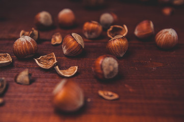 Still life with hazelnuts on a wooden background
