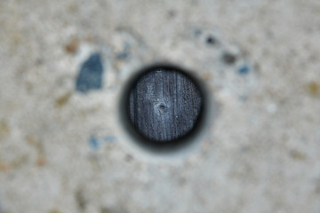 Fototapeta na wymiar Hole in a concrete fence.
