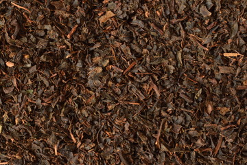 dry black tea leaves texture background