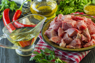 Raw meat chopped into pieces on a plate