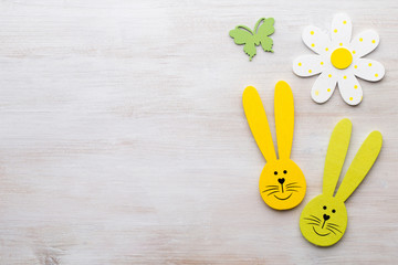 Spring and Easter decor. Wooden symbols bunny, flowers and butterflies.
