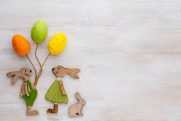 Spring and Easter decor. Wooden symbols bunny, flowers and butterflies.