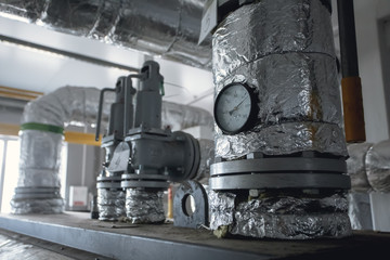 temperature gauge connect with pipeline background. Industrial water temperature meter