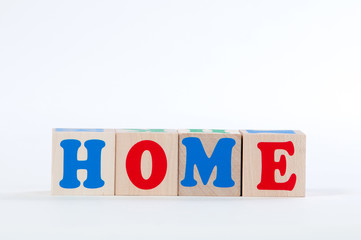 Alphabet blocks inscription house on a white background