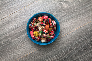 Hard Candies in a Bowl on a Wooden Table
