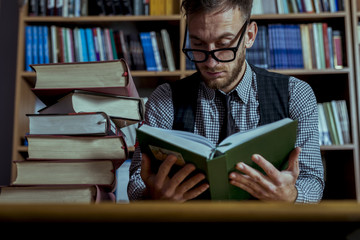 Student Working in Library at Night