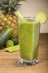 Green juice on wooden board