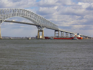 Tugs assisting tanker near Baltimore's Key Bridge