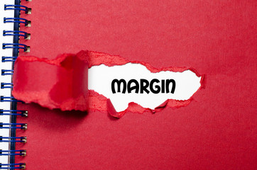 The word margin appearing behind torn paper