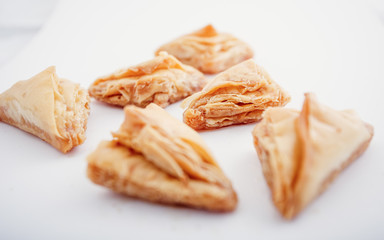 Arabian Eid dates sweets isolated. Oriental sweets with honey and nuts. Turkish Pakhlava Isolated On White. Turkish dessert.