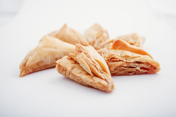 Arabian Eid dates sweets isolated. Oriental sweets with honey and nuts. Turkish Pakhlava Isolated On White. Turkish dessert.
