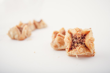 Arabian Eid dates sweets isolated. Oriental sweets with honey and nuts. Turkish Pakhlava Isolated On White. Turkish dessert.