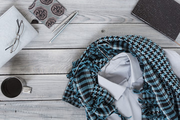 Fragment of a men's shirt with a keffiyeh on a hanger, diary, co